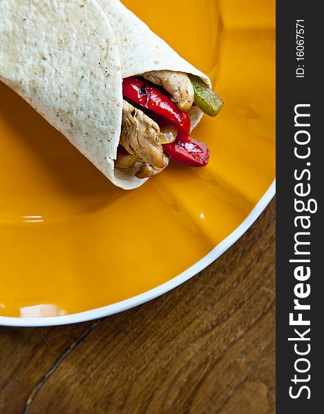 A delicious Mexican chicken fajita with red and green peppers