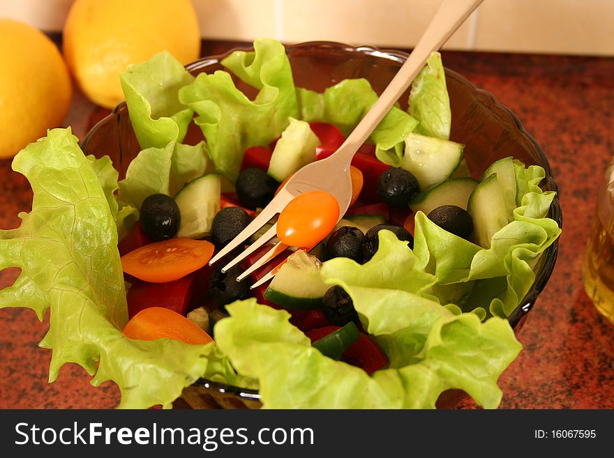 Fresh salad on a kitchen table