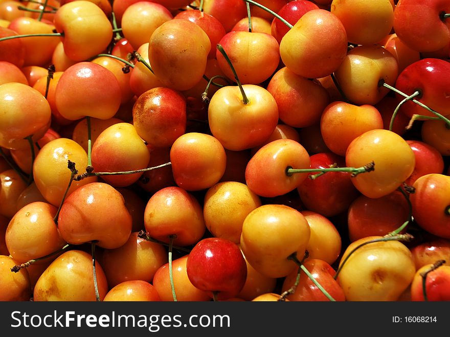 Red and yellow cherries texture