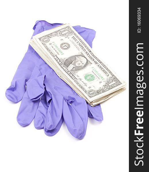 Dollar Bills on Forensic Gloves against white background Note: Differential Focus. Dollar Bills on Forensic Gloves against white background Note: Differential Focus