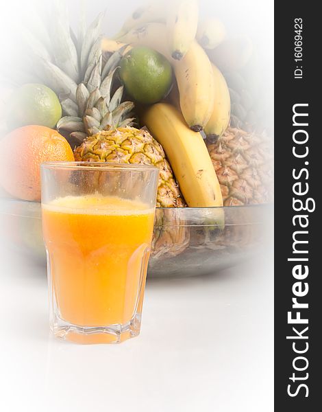 Orange natural fresh squeezed juice with fruits background, vinhetting on the background