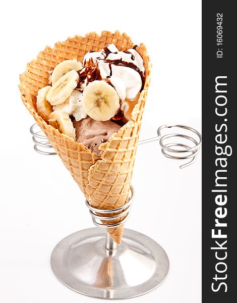 Mix ice cream cone with sliced banana and chocolate topping