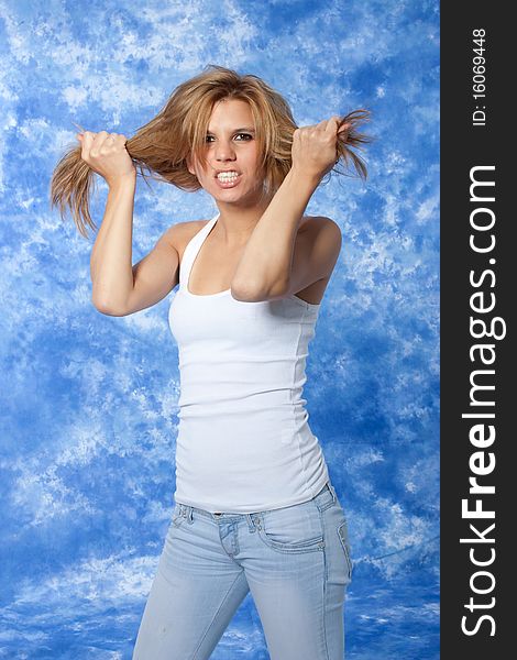 Female model posing anger pushing hair with hands. Female model posing anger pushing hair with hands