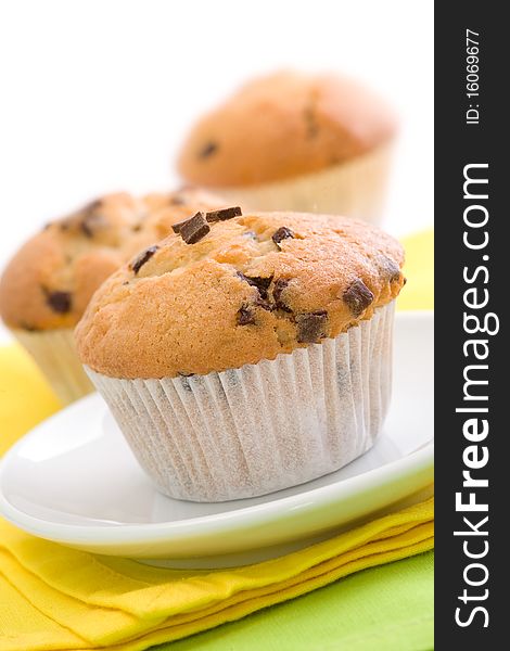 Chocolate chip muffins on white background