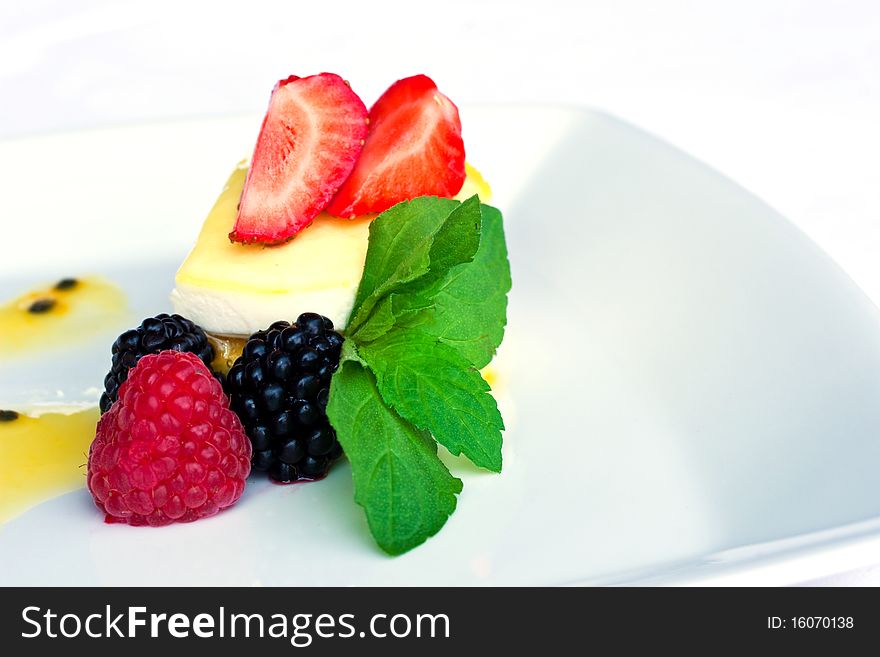 Delicious dessert with berries on a plate. Delicious dessert with berries on a plate