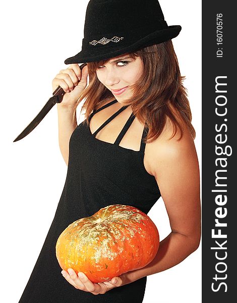 Witch holds in the hands pumpkin and knife