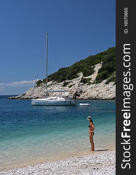 Holiday atmosphere on pebbly beach of croatian island Cres. Holiday atmosphere on pebbly beach of croatian island Cres.