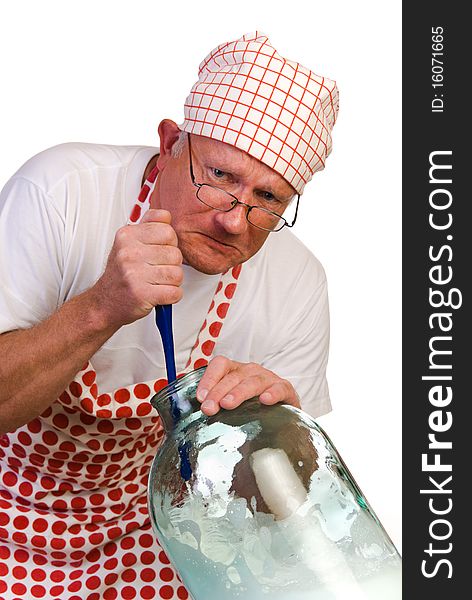 A man washing huge jar with brush. A man washing huge jar with brush