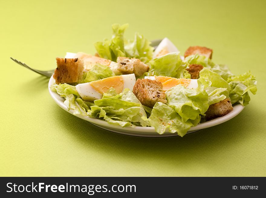 Salad with edds on green background. Salad with edds on green background