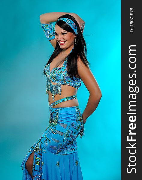 Beautiful sexy dancer woman in bellydance costume with pretty professional stage make-up