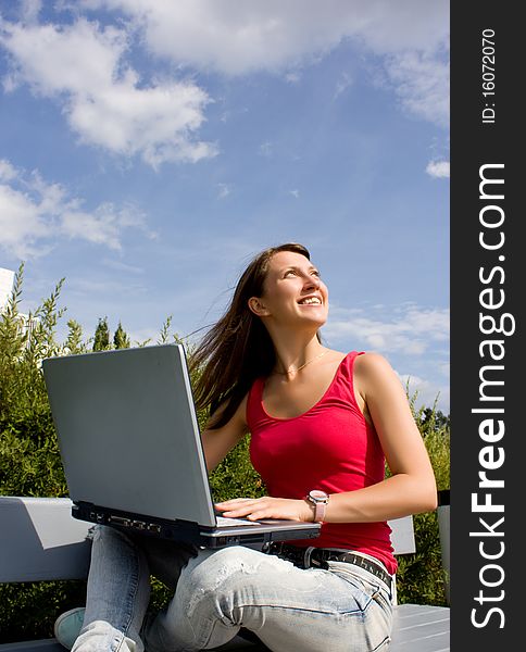 Beautiful college student working on her laptop