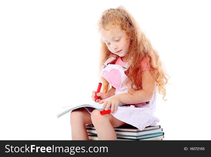 Portrait of a little girl sitting on a stack of books. Isolated over white background. Portrait of a little girl sitting on a stack of books. Isolated over white background.