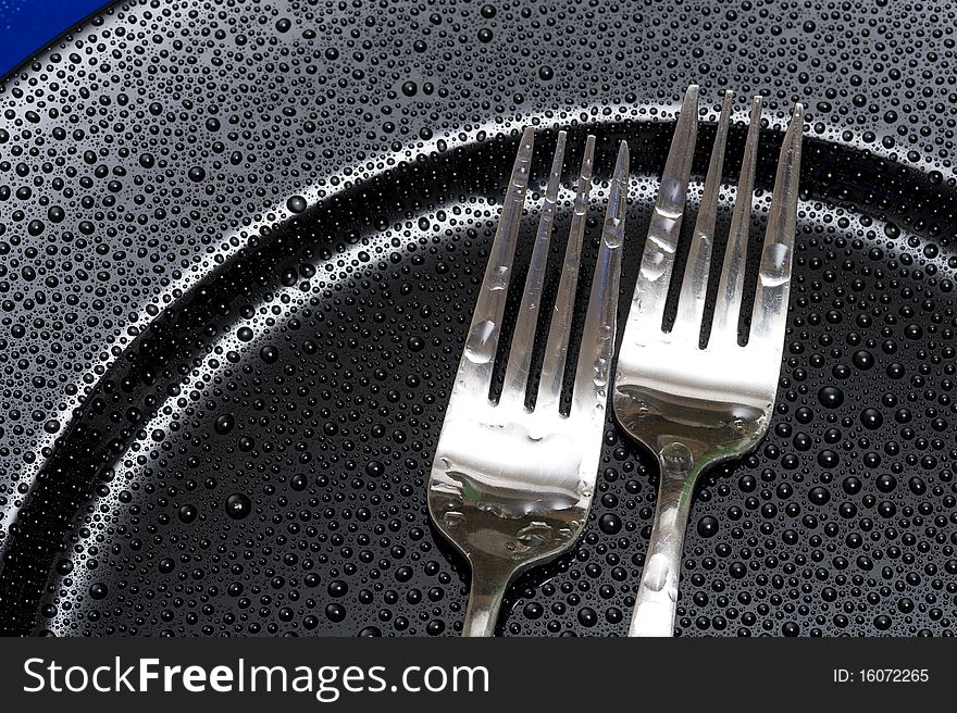 Fork on the black background