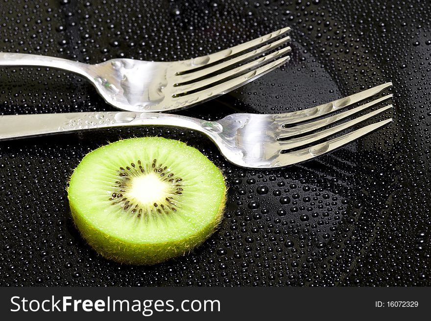 Fork on the black background