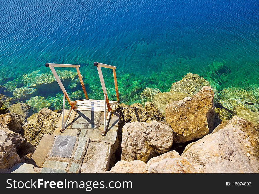 Stairs to sea - vacation beach background