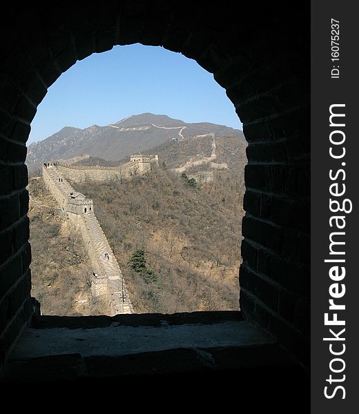 Looking out one of the turret windows at The Great Wall of China at Mutianyu, Beijing, Chin