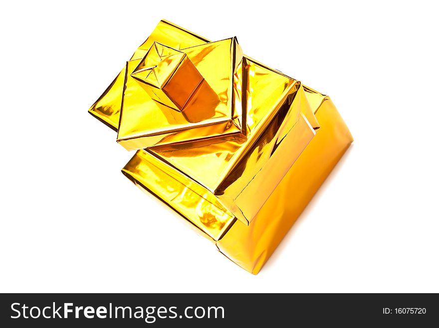 Four golden gifts boxes isolated on white