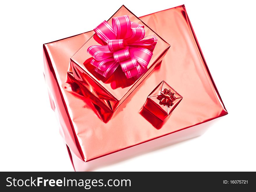 Red christmas gifts boxes with bow. Isolated on white