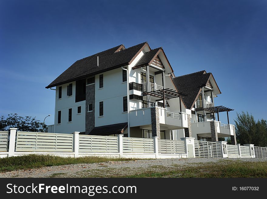 New home with Fencing on clear blue day. New home with Fencing on clear blue day.