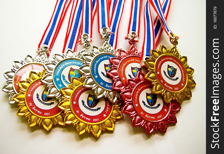 Medals to the winners in sporting events in the school colors. Medals to the winners in sporting events in the school colors.