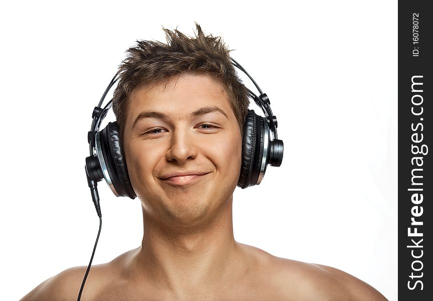 A portrait of a handsome DJ wearing a headset, isolated on a white studio background
