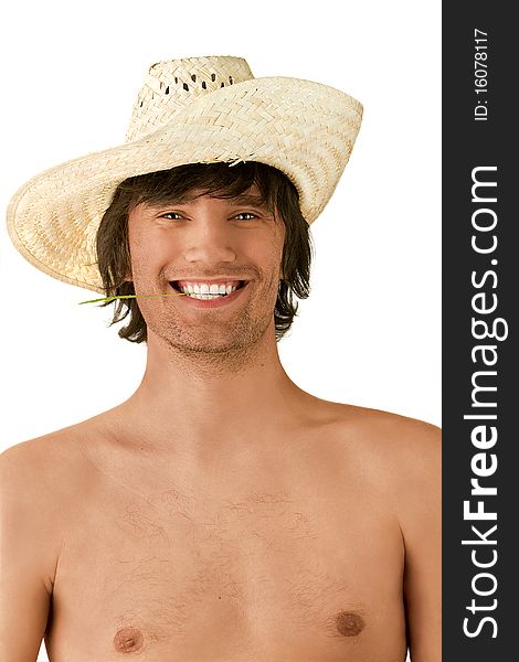 A young man smiling and wearing a straw hat. A young man smiling and wearing a straw hat