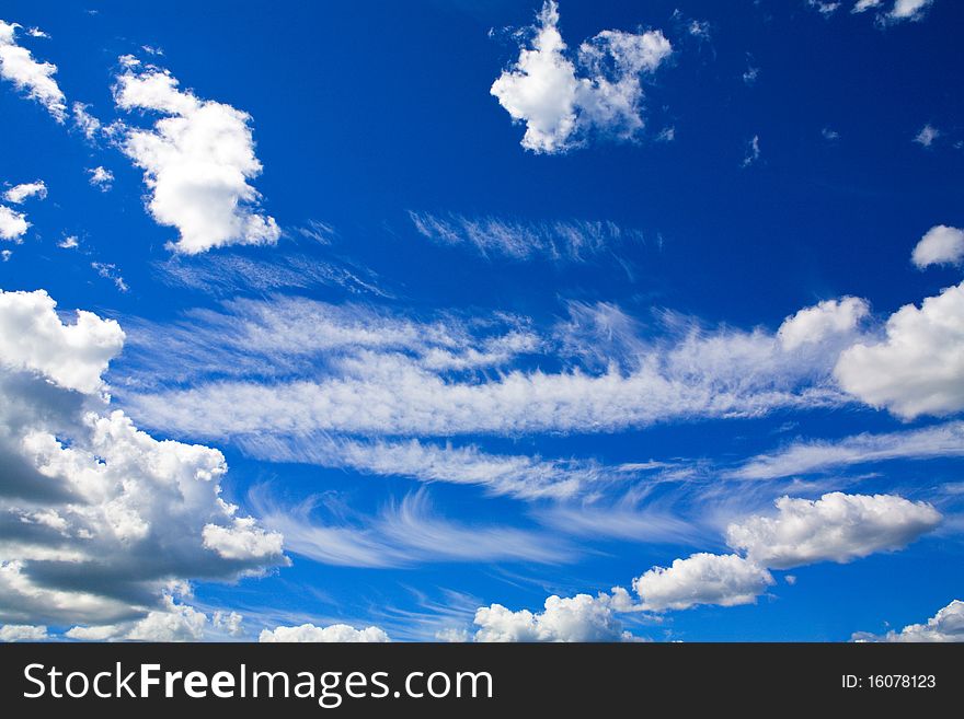 Sun shining over beautiful cumulus cloudscape in blue sky. Sun shining over beautiful cumulus cloudscape in blue sky