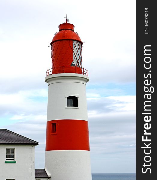 A Traditional British Red and White Lighthouse. A Traditional British Red and White Lighthouse.