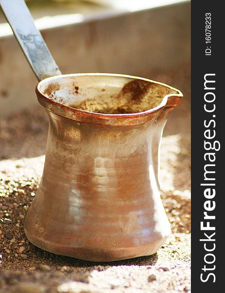 Turkish coffee in a brass pot. Turkish coffee in a brass pot