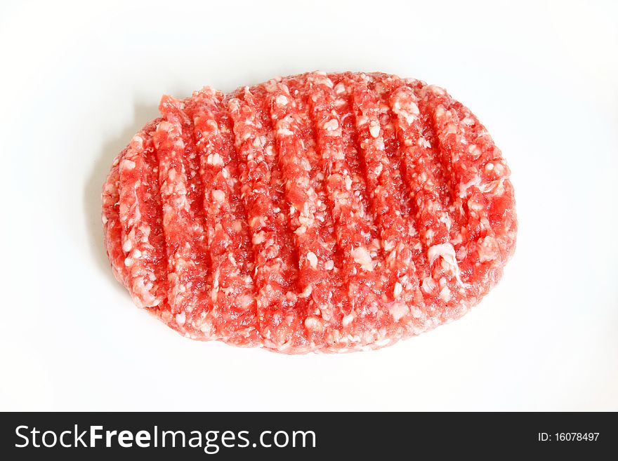 Raw hamburger on white background