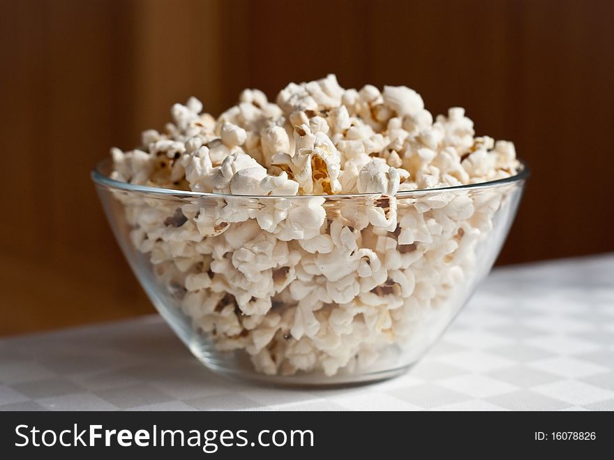 Popcorn in the bowl on the table
