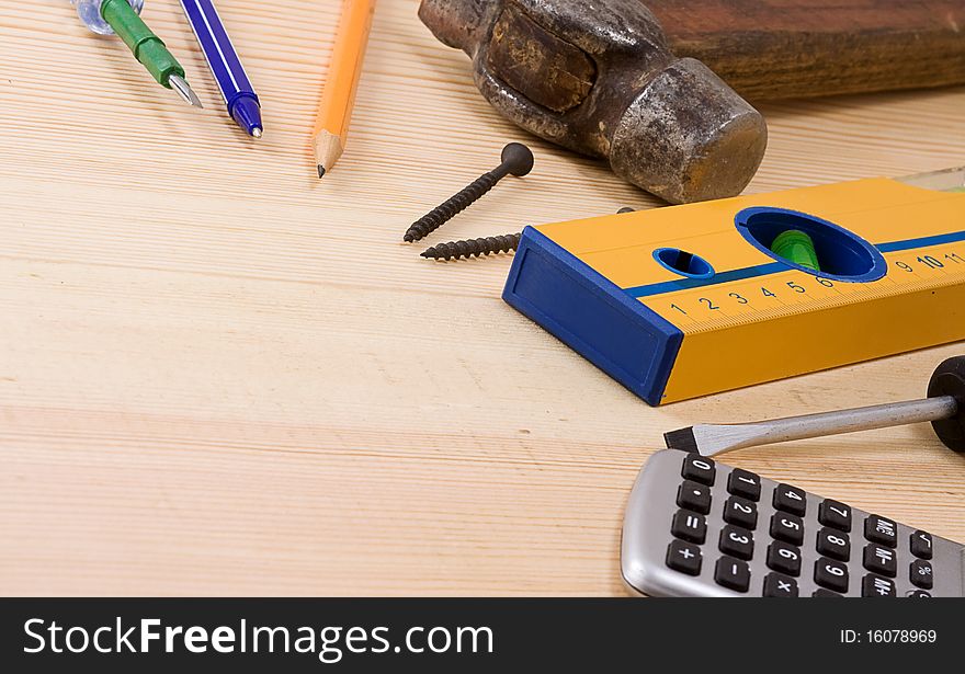 Tools and pens on wood texture