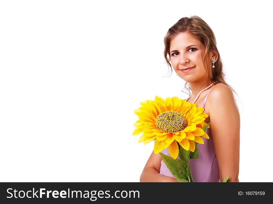 Portrait of a charming young girl in dress with sunflower