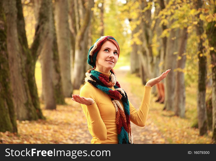 Young girl walking in autumn park. Young girl walking in autumn park