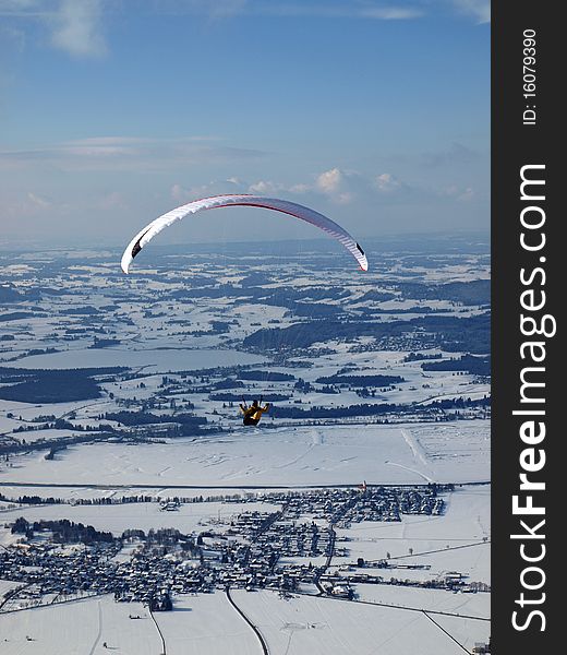 Paraglider flying over a valley in germany