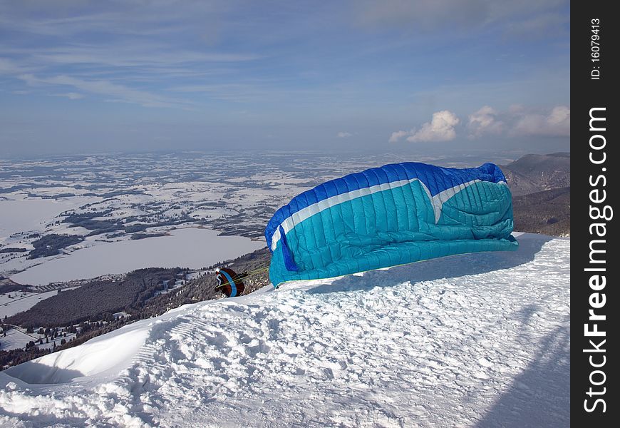 Paraglider Running Down A Slope On A Mountain