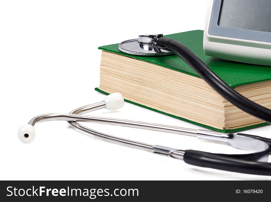 Green book and stethoscope on white
