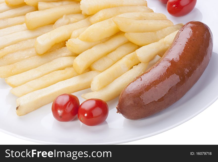 Fried potato with tomatoes and sausage on a plate.