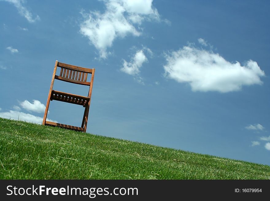 Wooden Chair On A Hilltop