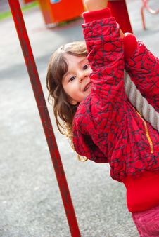 Little Girl Plays In Playground Stock Image