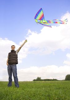 Man Standing And Playing With Kite Stock Images