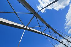 Modern Tied Arch Bridge Against Cloudy Blue Sky Stock Image