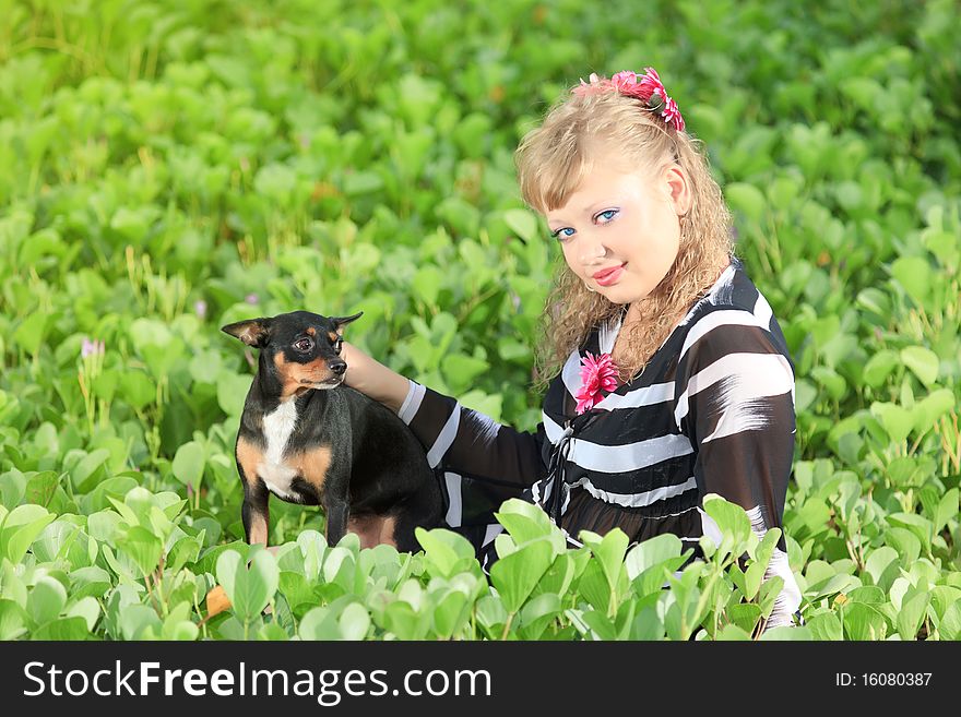 Beautiful young woman with her pet dog outdoor. Beautiful young woman with her pet dog outdoor