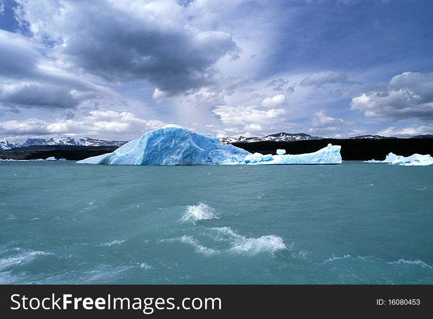 A iceberg sails in the cold waters of argentino lake - patagonia