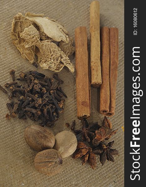 Assorted spices in brown background