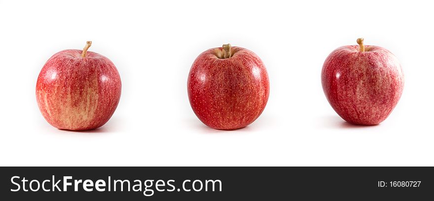 Three fresh red and yellow gala apples in a line on a white isolated background. Three fresh red and yellow gala apples in a line on a white isolated background.