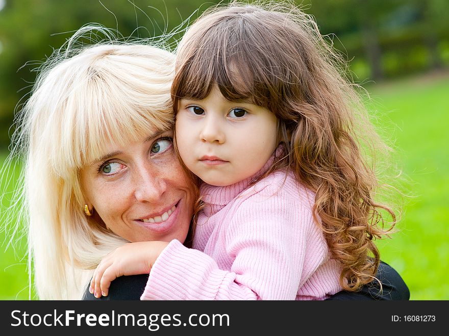 Happy mother and daughter in a park