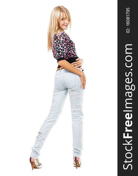 Pretty blonde in blue jeans against white background