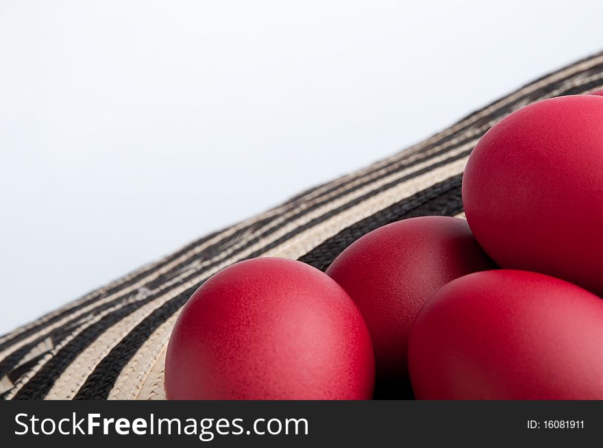 Many red Easter eggs on a specific Easter fabric.