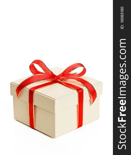 White gift box with red bow isolated on white background.